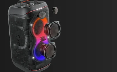 Cutaway view of a JBL portable speaker with three exposed drivers and rainbow RGB lighting.