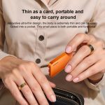 Card-sized orange portable device held between fingers, showing ultra-thin, pocket-friendly design.