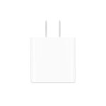 Close-up of a white two-prong power plug protruding from a white adapter.