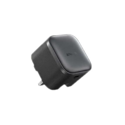 Black cube-shaped travel charger with a fold-out plug and textured sides; Anker branding on top.