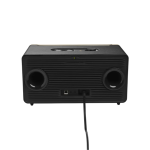 Black rectangular portable speaker with two large circular front drivers and a power cord plugged into the back.